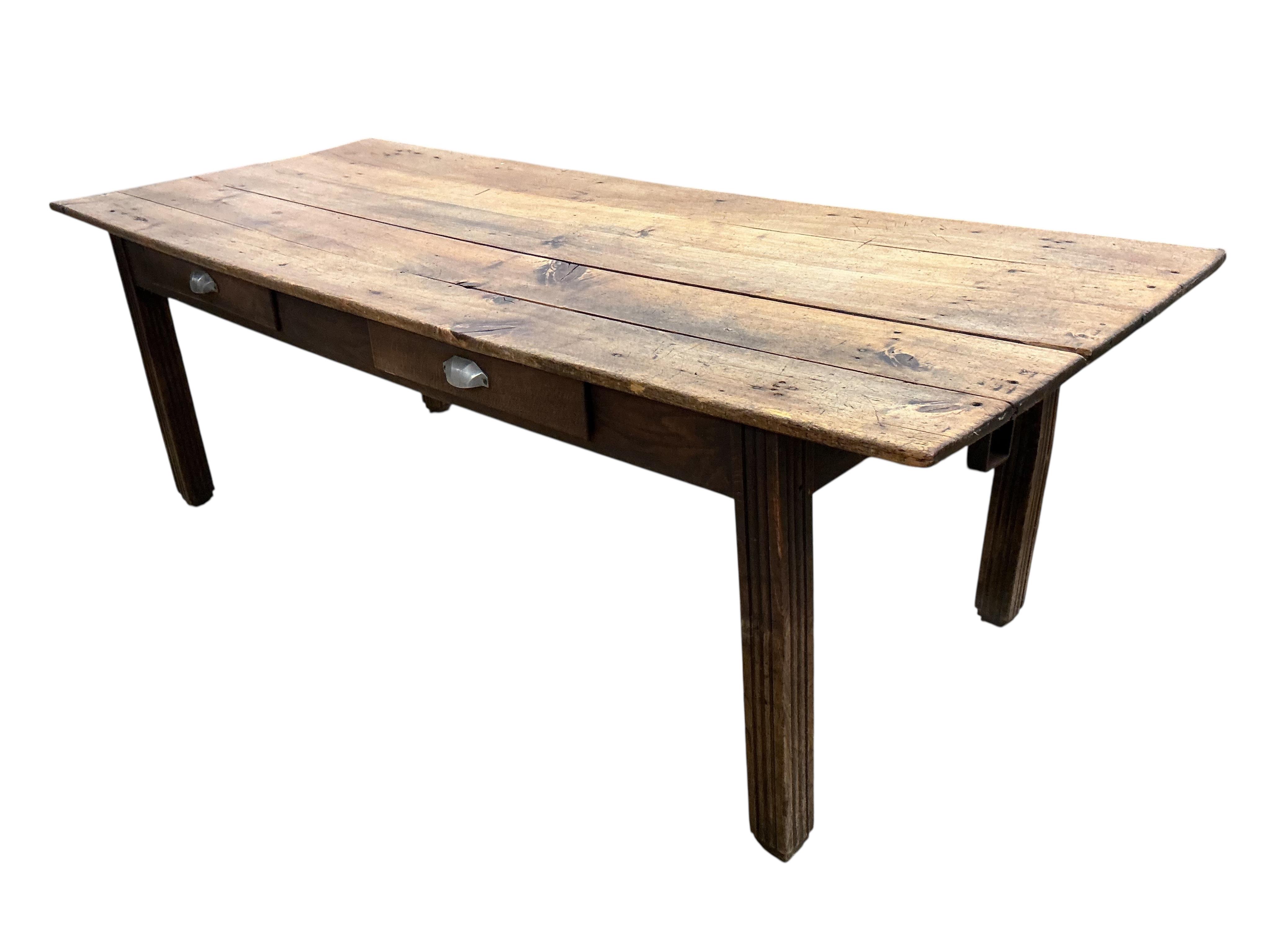 A 19th century French rectangular fruitwood kitchen table, width 224cm, depth 88cm, height 73cm